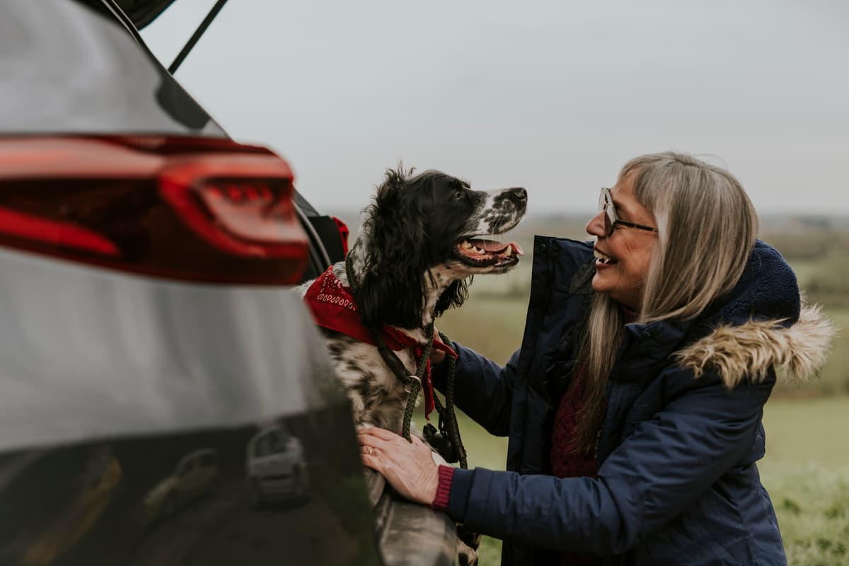 Woman with dog and car